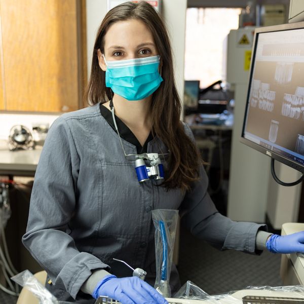 Dr. Elizabeth Bingham wearing protective gear during a dental procedure